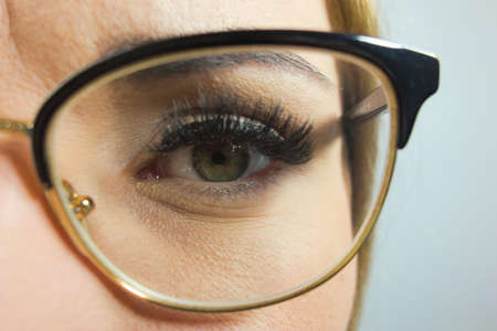 Beautiful young woman wearing glasses. Closeup viewの写真素材