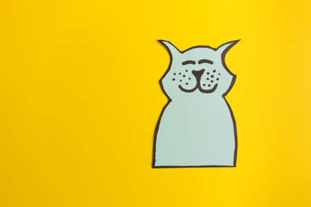 Happy cute dog drawing on yellow background. Copy space for your designの写真素材