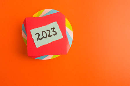 Happy new year 2023 background with number handwritten on sticky note, copy space for your designの写真素材