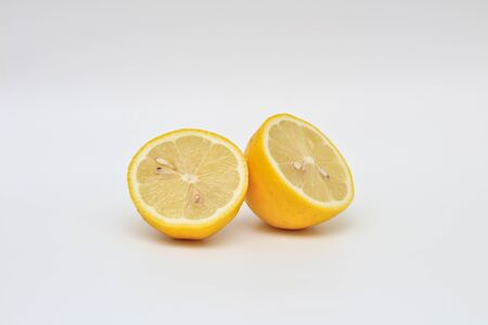 juicy bisected lemon on a white background. Studio macro shootの写真素材