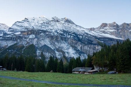 Wooden house in the mountains near Oeschinensee in Switzerland.