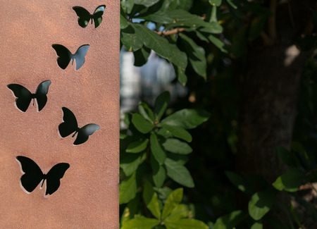 Butterfly metal work. Cast iron plate with artistic butterly shapeの写真素材