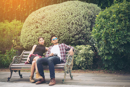 Young couple spending time together in the park in summer sunny day. Happy couple expressionの写真素材