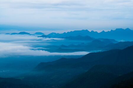 Silhouette mountain landscape and cloudsの写真素材