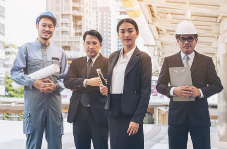 Engineering business team. Engineer, business man and business woman. Construction engineering business people concept.の写真素材