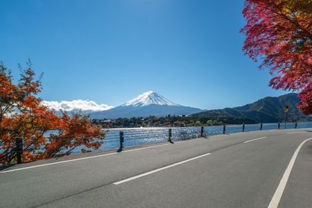 Colorful Autumn in Mount Fuji, Japan - Lake Kawaguchiko is one of the best places in Japan to enjoy Mount Fuji scenery of maple leaves changing color giving image of those leaves framing Mount Fuji.の写真素材