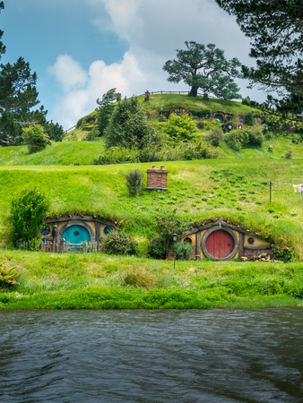 Matamata, New Zealand - Dec 11, 2016: Hobbiton movie set created for filming The Lord of the Rings and The Hobbit movies in North Island of New Zealand. It is opened for tourist who visit New Zealand.のeditorial素材