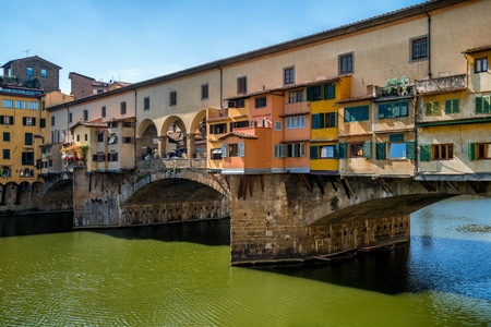 Florence Ponte Vecchio Bridge and City Skyline in Italy. Florence is capital city of the Tuscany region of central Italy. Florence was center of Italy medieval trade and wealthiest cities of past era.の写真素材