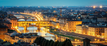 Florence Ponte Vecchio Bridge at Night Skyline in Italy. Florence is capital city of the Tuscany region of central Italy. Florence was center of Italy medieval trade and wealthiest cities of past era.の写真素材