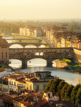 Florence Ponte Vecchio Bridge and City Skyline in Italy. Florence is capital city of the Tuscany region of central Italy. Florence was center of Italy medieval trade and wealthiest cities of past era.の写真素材