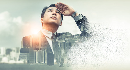 Double exposure - Business leader vision for success, looking away with modern buildings in city background. Concept of talented leadership.の写真素材