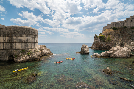 Old harbor of Dubrovnik old town, Croatia with Fort Lovrijenac (St. Lawrence Fortress) and Bokar Fort on a steep cliff in Dubrovnik old town, Croatia.の写真素材