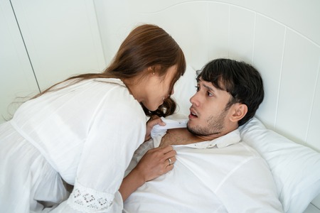 Furious girlfriend is angry at her boyfriend. Concept of unhappy marriage and divorce.の写真素材