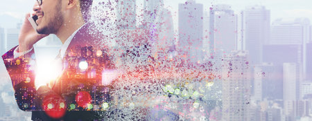 Surreal Image of Communication Concept - Young businessman using mobile phone with modern city...