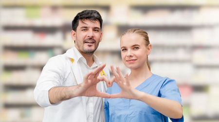 Doctors at hospital office working with another doctor. Healthcare and medical services.の写真素材