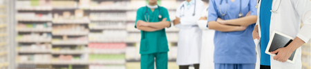 Healthcare people group. Professional doctor working in hospital office or clinic with other doctors, nurse and surgeon. Medical technology research institute and doctor staff service concept.の写真素材