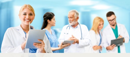 Healthcare people group. Professional doctor working in hospital office or clinic with other doctors, nurse and surgeon. Medical technology research institute and doctor staff service concept.の写真素材