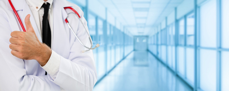 Young male doctor working at the hospital. Medical healthcare and doctor staff service.の写真素材