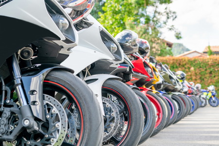 Motorcycles group parking on city street during adventure journey. Motorcyclists community travel concept.の写真素材