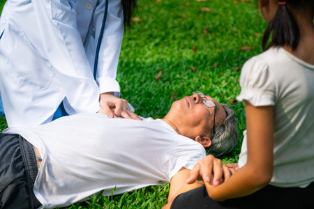 Senior man having chest pain or heart attack in the park. Old people elderly healthcare concept.