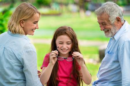 Happy family go vacation on weekend in the garden park in summer. Kid education and family activities concept.の写真素材