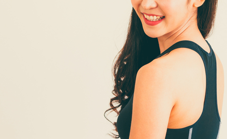 Strong and confident Asian woman in fitness gym. Healthy lifestyle concept.の写真素材