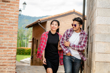 Happy young couple walking on the street in old town. Travel and dating concept.の写真素材