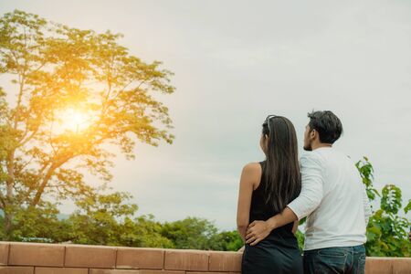 Happy couple take a romantic walk on the hills. Travel and honeymoon concept.の写真素材