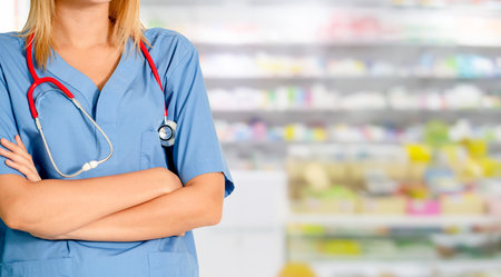 Woman pharmacist working at pharmacy. Medical healthcare and doctor staff service.の写真素材