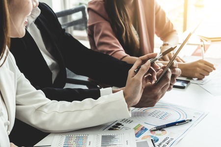 Businessman is in meeting discussion with colleague businesswomen in modern workplace office. People corporate business team concept.の写真素材