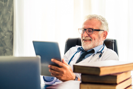 Doctor working in hospital office. Medical healthcare concept.の写真素材