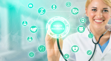 Health Insurance Concept - Doctor in hospital with health insurance related icon graphic interface showing healthcare people, money planning, risk management, medical treatment and coverage benefit.の写真素材
