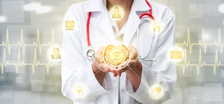 Medical Healthcare Concept - Doctor in hospital with digital medical icons graphic banner showing symbol of medicine, medical care people, emergency service network, doctor data of patient health.の写真素材