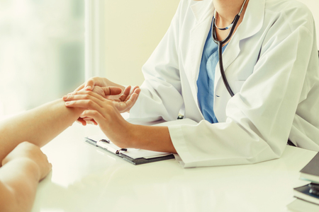 Female patient visits woman doctor or gynecologist during gynaecology check up in office at the hospital. Gynecology healthcare and medical service.の写真素材