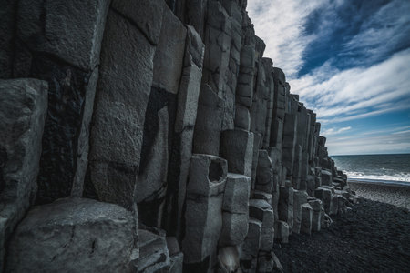 Beautiful and unique volcanic rock formation on Iceland black sand beach located near the village of...