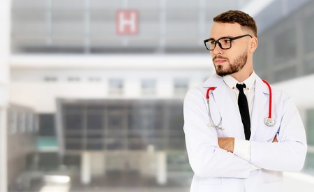 Young male doctor working at the hospital. Medical healthcare and doctor staff service.の写真素材
