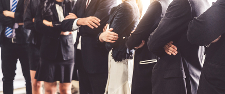 Many business people meeting standing in row with arms crossed and confident. Company organization employee unity and support. Concept of corporate partnership and human resources growth management.の写真素材