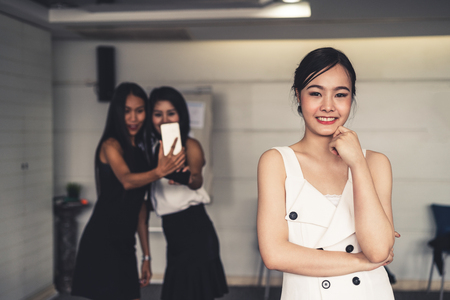 Young Asian businesswomen standing in office. Business friends and community concept.の写真素材