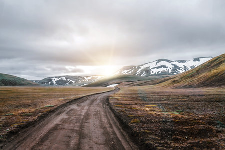 Beautiful Landmanalaugar gravel dust road way on highland of Iceland, Europe. Muddy tough terrain for extreme 4WD 4x4 vehicle. Landmanalaugar landscape is famous for nature trekking and hiking.の写真素材