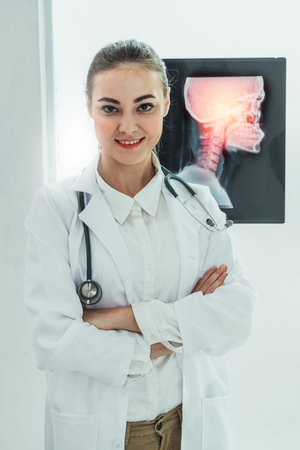 Female doctor working with x ray film of patient head and diagnose skull injury. Medical and...