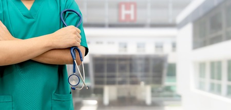 Surgeon doctor standing in hospital. Medical healthcare staff and doctor service.の写真素材
