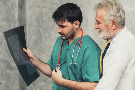 Doctors at hospital working with another doctor.