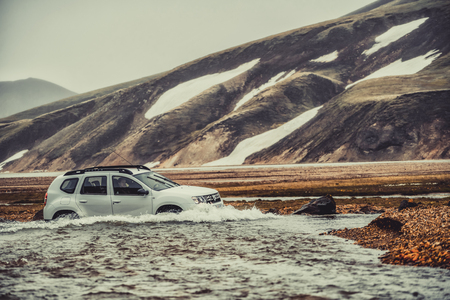 Landmannalaugar, Iceland - July 2, 2018: 4WD vehicle car travel off road in landscape of Landmannalaugar in highland of Iceland, Nordic, Europe. The place is famous for summer outdoor trekking way.のeditorial素材