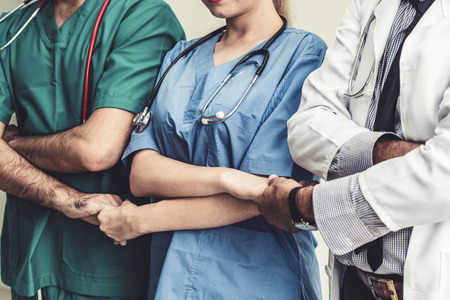 Healthcare people group. Professional doctor working in hospital office or clinic with other doctors, nurse and surgeon. Medical technology research institute and doctor staff service concept.の写真素材