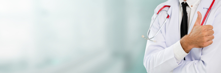 Young male doctor working at the hospital. Medical healthcare and doctor staff service.の写真素材