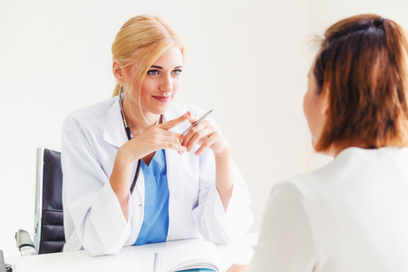 Female patient visits woman doctor or gynecologist during gynaecology check up in office at the hospital. Gynecology healthcare and medical service.の写真素材