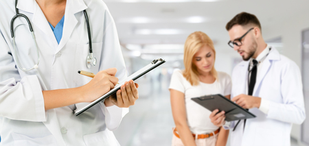 Healthcare people group. Professional doctor working in hospital office or clinic with other doctors, nurse and surgeon. Medical technology research institute and doctor staff service concept.の写真素材