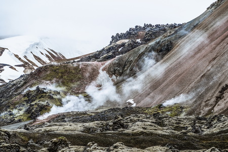Landscape of Landmannalaugar surreal nature scenery in highland of Iceland, Nordic, Europe. Beautiful colorful snow mountain terrain famous for summer trekking adventure and outdoor walking.の写真素材