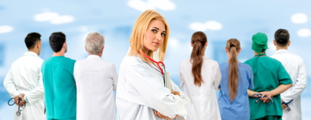 Healthcare people group. Professional doctor working in hospital office or clinic with other doctors, nurse and surgeon. Medical technology research institute and doctor staff service concept.の写真素材