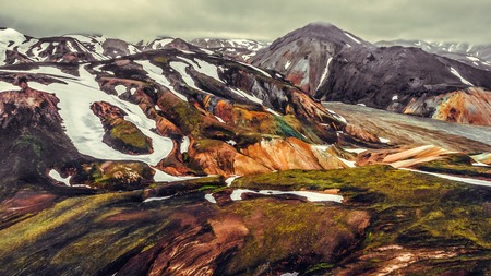 Aerial view landscape of Landmannalaugar surreal nature scenery in highland of Iceland, Europe. Beautiful colorful snow mountain terrain famous for summer trekking adventure and outdoor walking.の写真素材